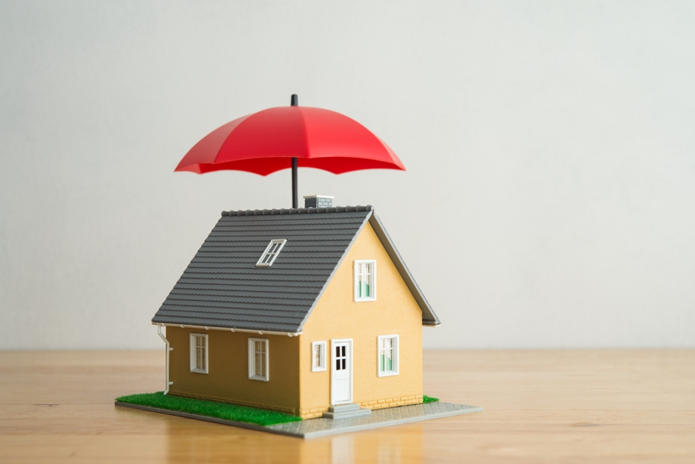 Red,Umbrella,Cover,Home,Model,On,Wooden,Table,With,White